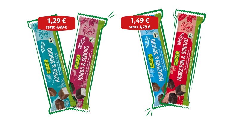 Vier Rapunzel Glücksstücke-Schokoriegel in verschiedenen Sorten in Aktion